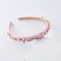 Detail view of pink crystal flower headband with rhinestones and anti-slip velvet lining - Pink