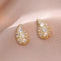 Golden teardrop earrings with pavé set cubic zirconia on elegant purple silk - Teardrop Style (E0921) / Gold