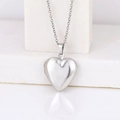 Polished silver heart locket pendant necklace in stainless steel on white pedestal - Smooth Heart 19*23/Steel