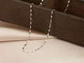Minimalist silver titanium steel flat snake chain necklace draped on a wooden box - Lip Chain (Flat Chain) / 40+5cm / Silver
