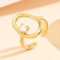 Adjustable hollow oval baroque ring with a four-prong set round crystal in golden finish - Gold with Clear White Stone