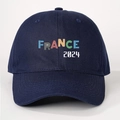 Detailed close-up of dark blue cotton baseball cap with FRANCE 2024 artistic embroidery - Navy Blue