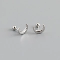 Detail view of silver crescent moon stud earrings with secure ball screw back design - White Gold