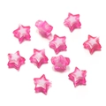 Macro shot of two-tone rose red and white acrylic star beads for DIY jewelry making - Deep Pink