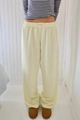 Detail of high waist striped wide leg trousers with elastic band and studio label - XS / Bottoms / Light Yellow