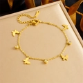 Close-up of gold-plated stainless steel bracelet featuring butterfly and zircon charms - Butterfly Style (B1477)
