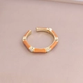 Detail of bamboo-style adjustable ring with orange enamel and zircon accents - Adjustable Open / Orange