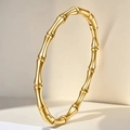 Polished gold stainless steel bamboo joint bracelet with minimalist aesthetic - Gold Bamboo Round (14-B-7)