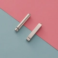 Close-up of silver stainless steel cylinder and rectangular prism DIY jewelry pendants - Cylinder / Steel (Inner) + Steel (Outer)