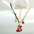 Detail of Christmas bracelet with red enamel stocking charm and green braided rope - Christmas Stocking Style (HLBX2025)