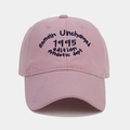 Macro detail of high-quality navy blue retro embroidery on a pink cotton baseball cap - Adjustable / Pink