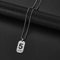 Macro shot of silver stainless steel dog tag pendant with 5 LUCKY engraving - Number 5