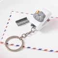 Mini portable white stapler keychain with cute grey storm cloud cartoon character - Angry Dark Cloud