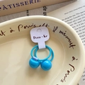 Elastic blue hair tie for girls featuring two shiny round beads and a woven rope band - Blue