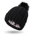 Black knit beanie with smooth satin lining and faux fur pompom on white background - One Size / Black