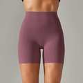 Close-up of high-waist yoga shorts in mauve with seamless knit and tummy control - Burgundy
