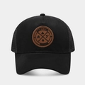 Close-up of black mesh trucker hat with brown leather patch featuring Enjoy Life design - Adjustable / Solid Black
