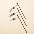 Three cat teaser wands featuring iridescent wings, feathers, and bells on black poles - Sequin Feather Insect