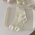 Chic cream white crew socks featuring subtle vertical ribbing and delicate bow patterns - One Size / Cream