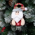 Plush Santa Claus ornament made of red burlap and felt hanging on a Christmas tree - Santa Claus