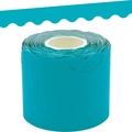 Close-up of bright cyan wavy border sticker roll for classroom bulletin board decoration - Teal