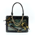Detail of gothic tote bag with spider web panel, golden chains, and butterfly charms - Black & Gold Butterfly