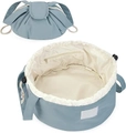 Detail view of the drawstring cosmetic bag showing its blue nylon fabric and inner pocket - Royal Blue