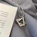 Detail of silver interlocking square and triangle pendant on a durable box chain - Silver