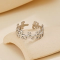 Silver adjustable open ring with leaf vine pattern on a textured ceramic base - Leaf Steel Color 78