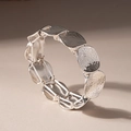 Detailed view of silver-tone bracelet with hammered texture oval metal discs - Silver