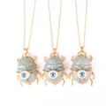Three gold scarab necklaces with blue eye patterns and grey-green stones on white background - Labradorite (No Chain)