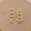 Golden alloy connector with three hollow hearts and double rings for DIY jewelry - Bright Gold