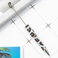 Leopard print beaded ballpoint pen featuring stylish silver metal accents on desk - White Base Brown Leopard (107)