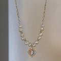 Baroque pearl necklace with gold cutout pendant and shimmering moonstone center - Gold Hollow Pearl Necklace (103#)