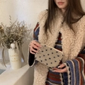 Plush beige faux fur storage pouch with blue polka dots and a metal zipper closure - Lamb Wool Heart Rice Blue
