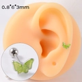 Orecchino a farfalla verde in acciaio inox con chiusura a vite 0,8x6x3mm sul modello - Farfalla Verde