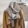 Grey pleated scarf with accordion texture styled on a camel wool coat for winter fashion - Light Gray