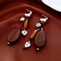 Close-up of vintage wood beaded earrings with silver needle and engraved heart charms - Silver Needle-Silver-Coffee