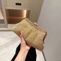 Luxurious gold evening clutch bag covered in sparkling rhinestones with a metal frame - Gold
