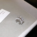 Macro shot of silver zircon flower ear cuff with white pearls on a grey velvet tray - Pearl Zircon Ear Cuff (11#)