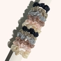 Close-up of thin organza silk scrunchies in metallic silver, gold, and champagne colors - Shimmer Organza Multicolor