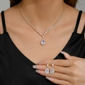 Elegant gold-plated waterdrop zircon necklace and earrings set worn by model - Clip-on Set / Gold Clip-ons