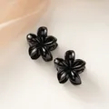 Set of two black glossy frangipani flower hair claws for elegant ponytail styling - Black [4cm Small]