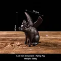 Nordic vintage style cast iron flying pig figurine with rustic texture on wooden surface - Flying Pig 8295