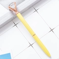 Yellow metal ballpoint pen with a large clear diamond top and rose gold hardware - Candy Yellow
