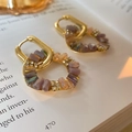 Baroque style gold hoop earrings with purple and champagne crystals on open book pages - Hoop Earrings-Gold
