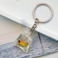 Creative resin water bag keychain featuring a vivid yellow fish in a transparent ocean pouch - Yellow Fish
