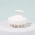 White silicone scalp massager brush with ergonomic handle for hair washing and cleaning - White