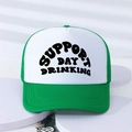 Close-up of Support Day Drinking text on a green and white mesh trucker hat - One Size / Green and White