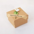 Square brown kraft paper gift box with a white calla lily and specially for you label - Kraft Box with Flower Decor